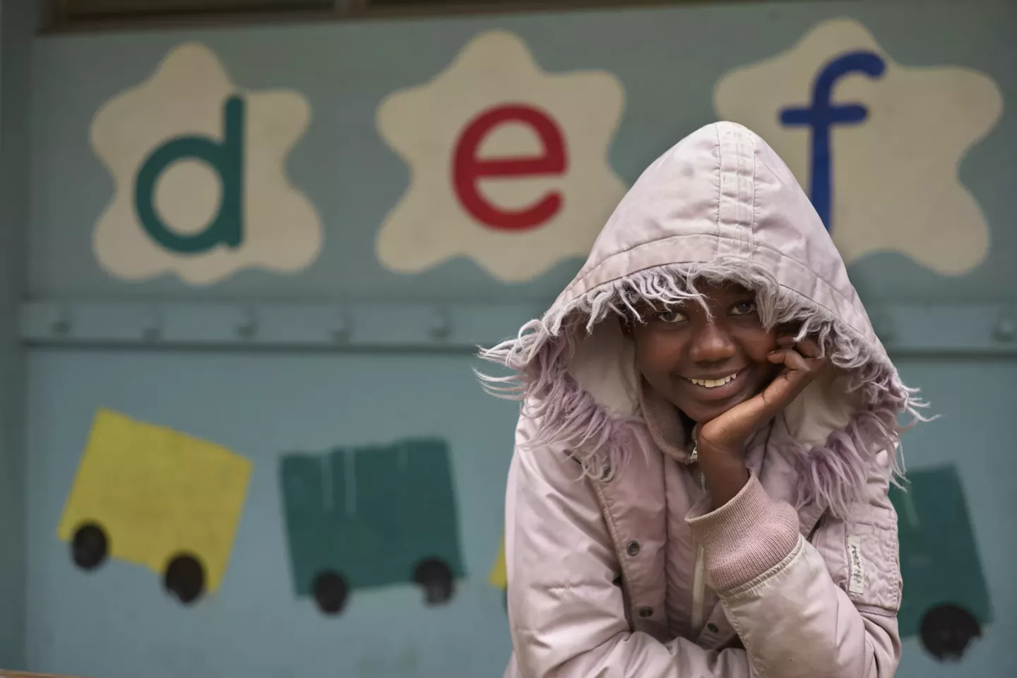 A young girl smiles