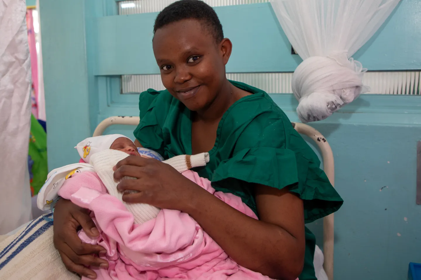 Mary Wanjiru holds her newborn baby