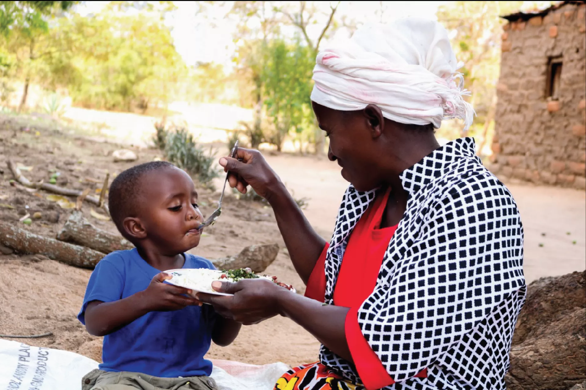 Mother feeds child