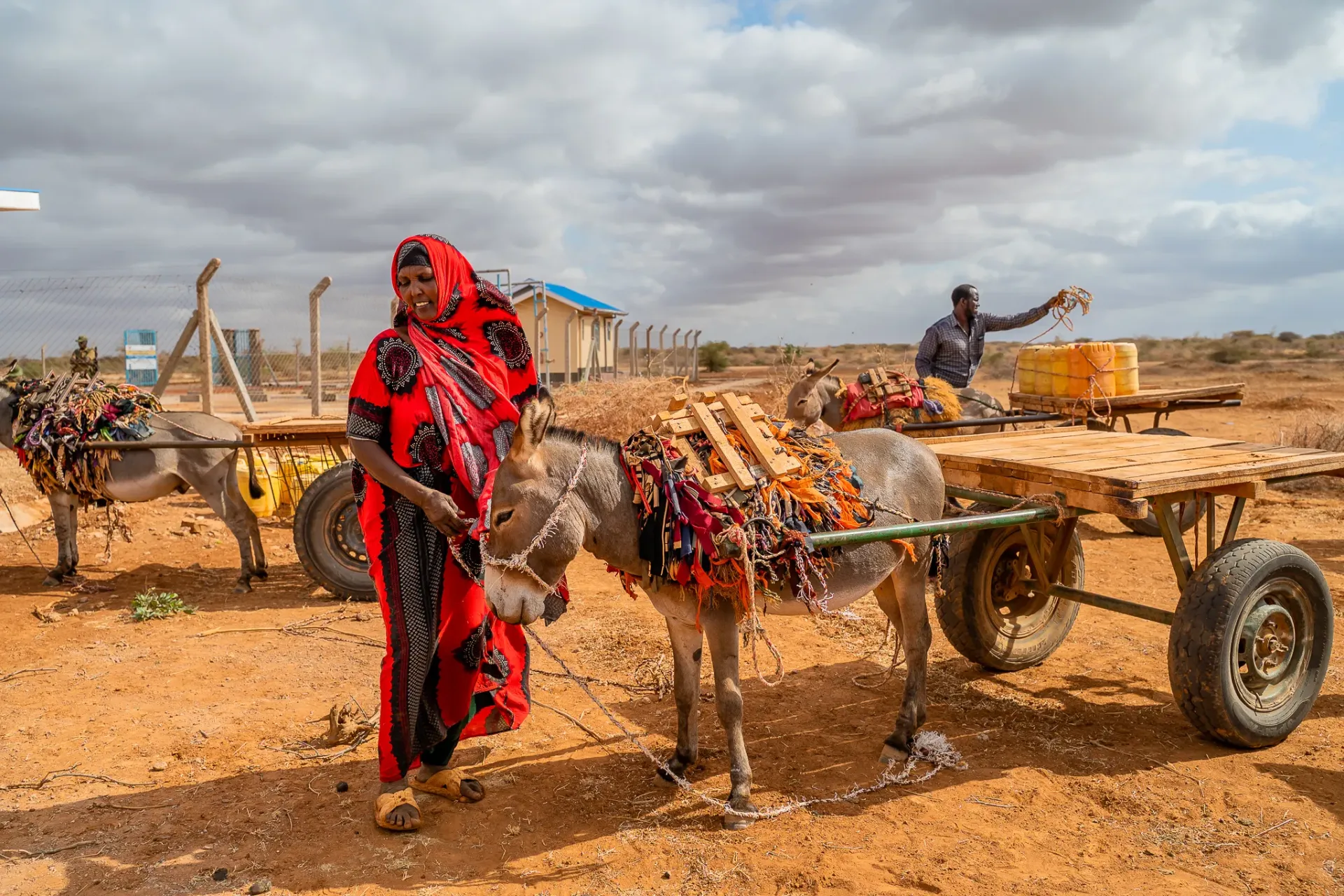 Man and woman fetch water in Griftu, Wajir