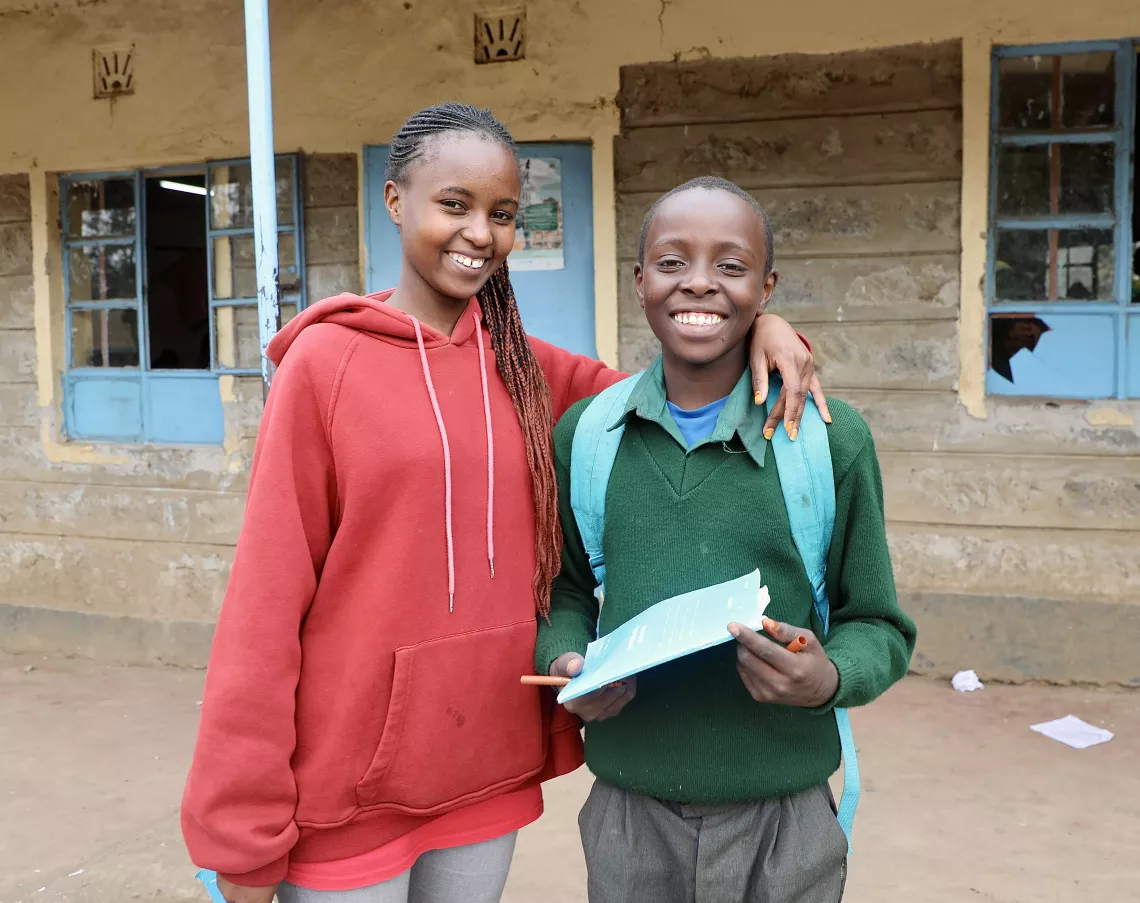Kinyanjui with his sister and guardian 20-year-old Faith Wangari 