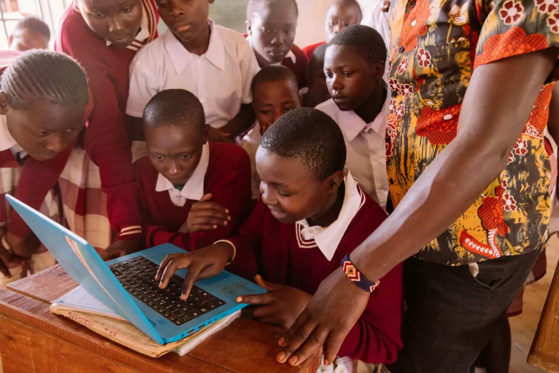 Micah Taabu, Teacher at Kamukuywa AC School in Bungoma, with his JSS class 