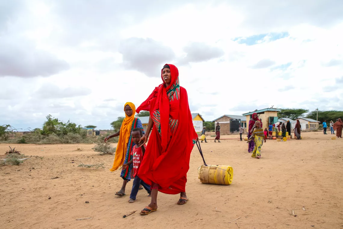 Nasra Garane Farah pulls jerrycan full of water