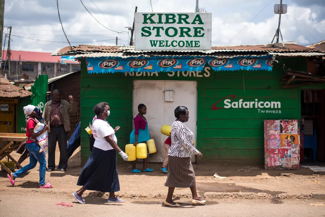  Community Health Volunteers walk to a water station