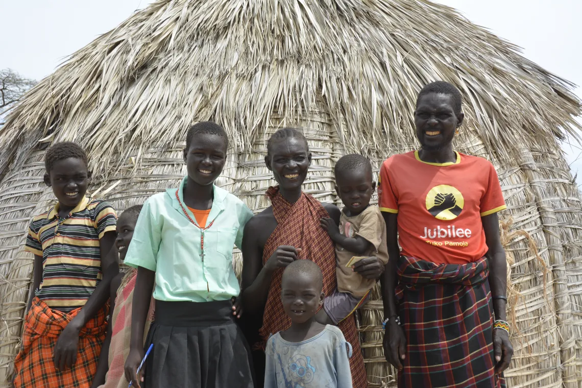 Irene and her family smile and say &ldquo;ngakipi na asolar&rdquo;, solar powered water in Turkana