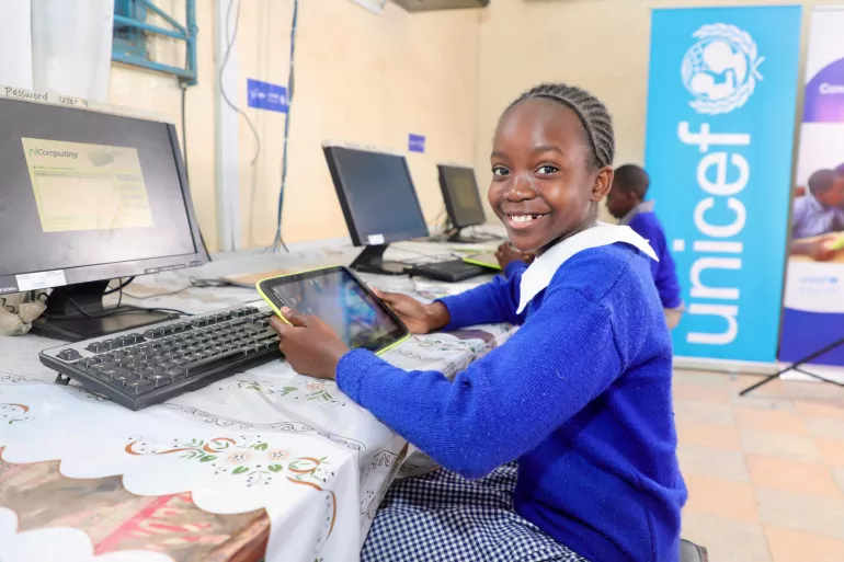 Girl uses tablet at Kilimani Primary School, Nairobi County.