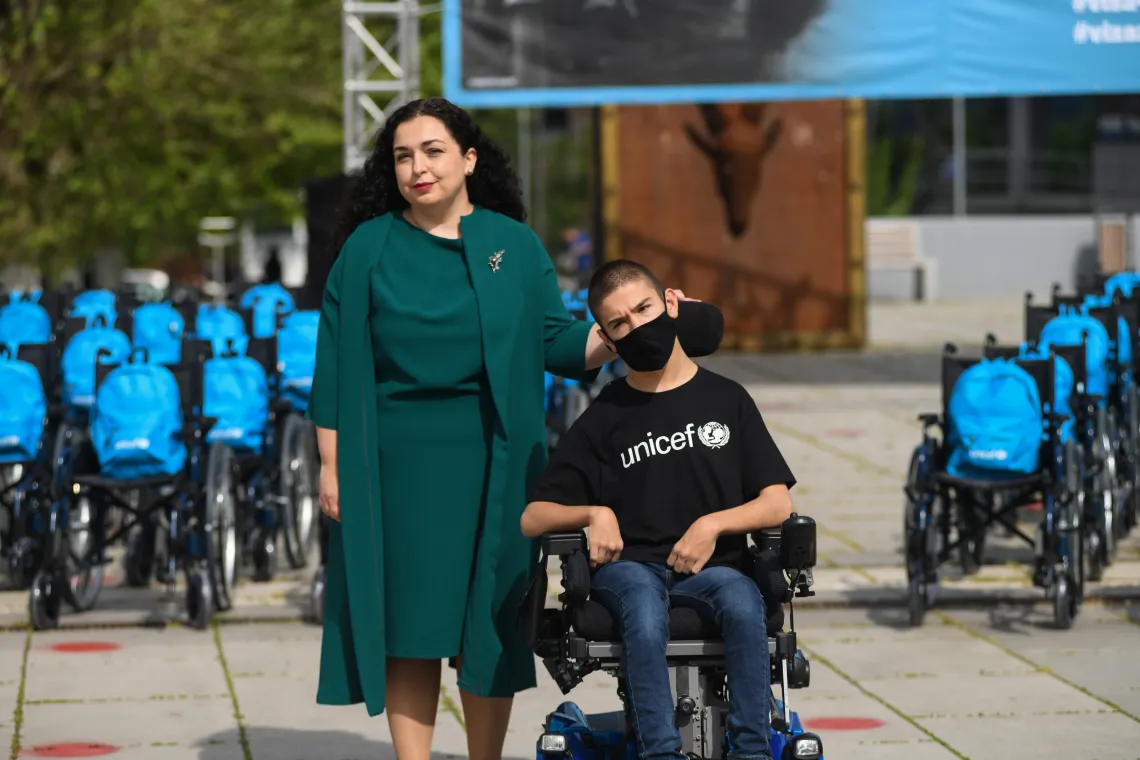 Rijad Mehmeti (UNICEF advocate) with President of Kosovo Vjosa Osmani during Wheel Chair exhibition in 2020