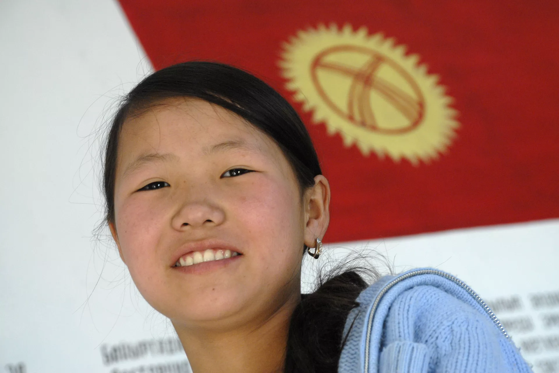 a girl with Kyrgyzstan flag