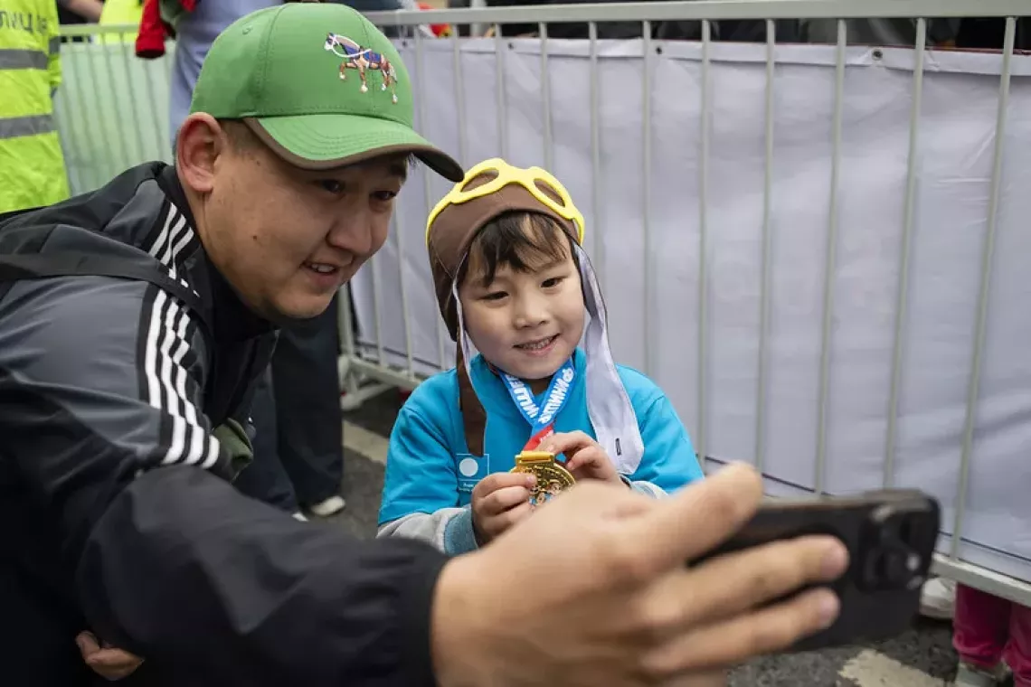 father is taking a selfie with his daughter