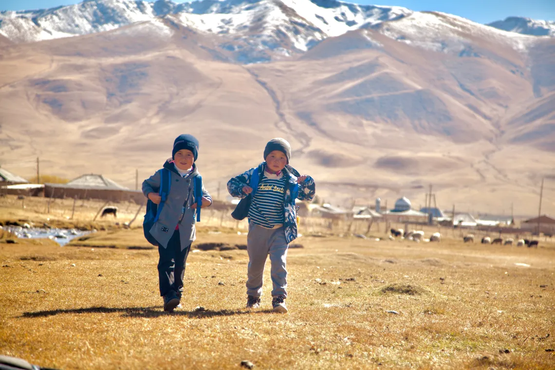 Students walking to the school named after Kylych Rysmendiev in the village of Lahol, Naryn region.