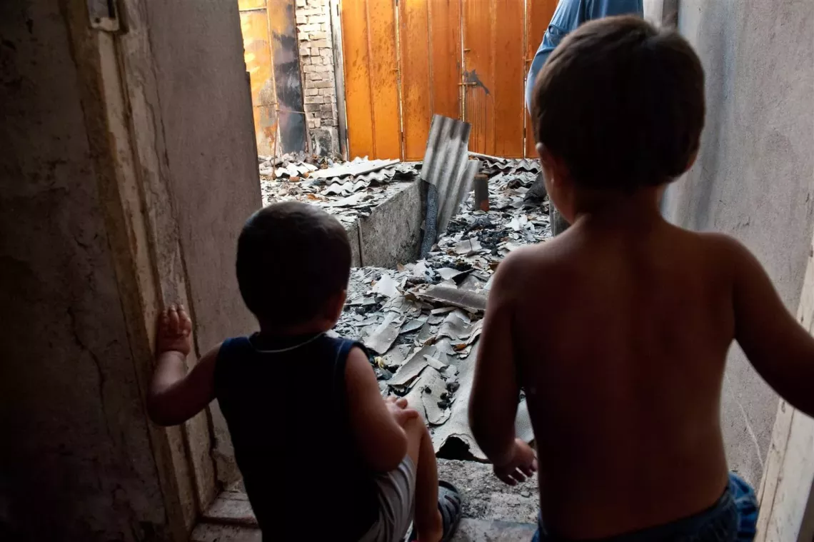 children at a ruined house