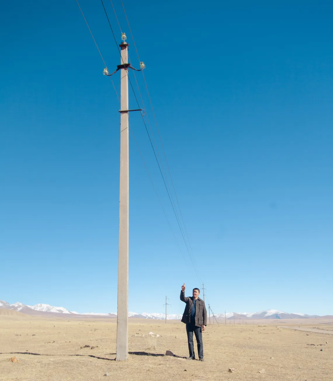 Telman Sydykov from telecom company points at the result of their hard work &ndash; wire which now connects remote mountainous village to the Internet. 