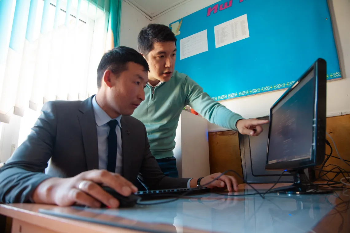 School administration from the hard-to-reach region together with UNICEF representative is testing the access to the Internet. 