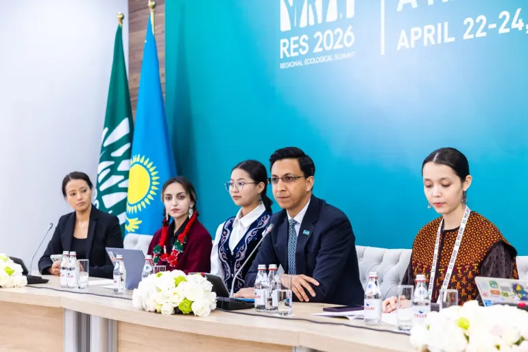 A group of young people from Central Asia are sitting on the press conference