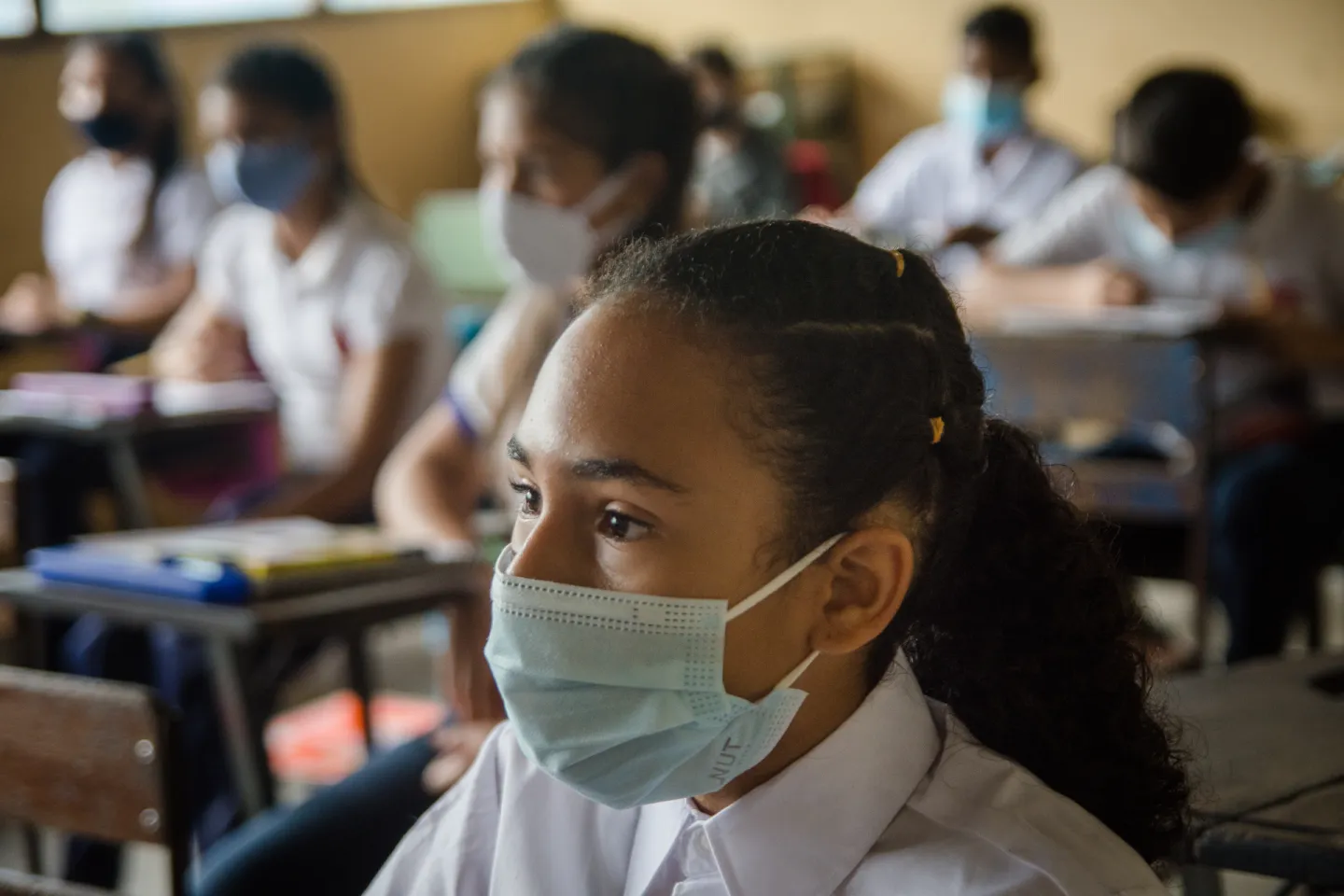 Students with masks in the classroom.
