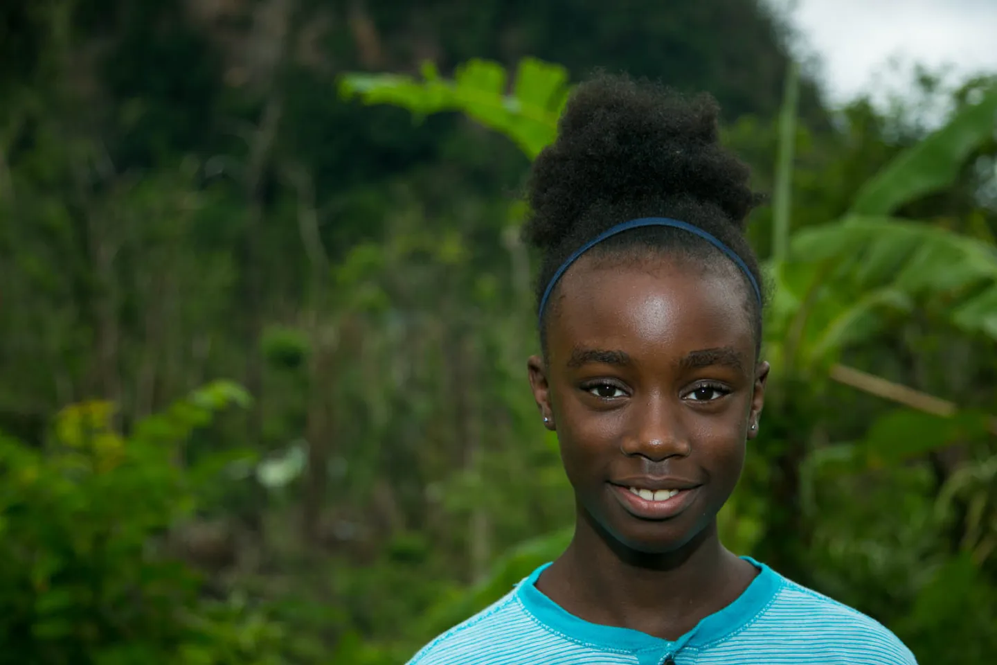 Caribbean teenager girl smiling.