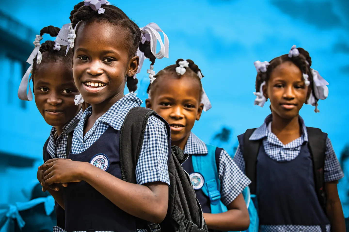On 23 November 2016 in Haiti, (left to right) &Eacute;lodie (7), Givelore (8), Francesca (6), &Eacute;rica (8) gather outside their school, the Notre Dame de Lourdes school, in J&eacute;r&eacute;mie.