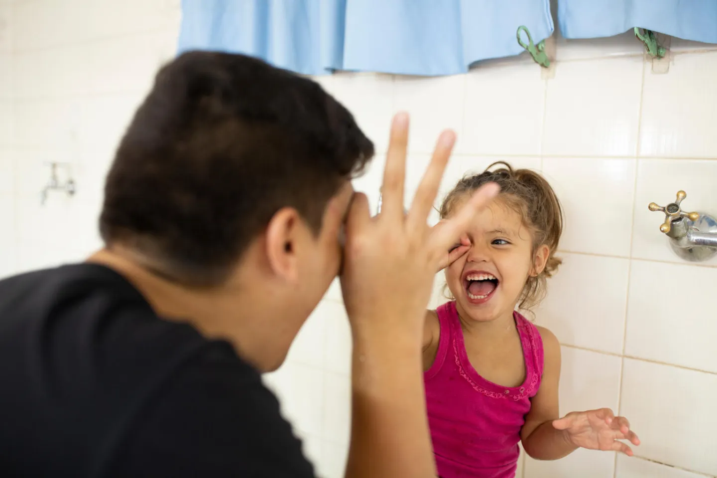 Father goofs around with her daughter