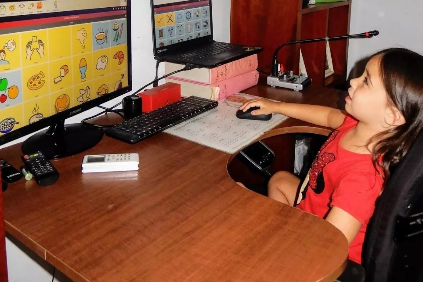 Girl using Cboard -an AAC open source web application for children and adults with speech and language impairments