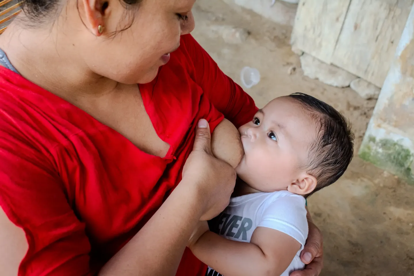 A woman breastfeeding a baby