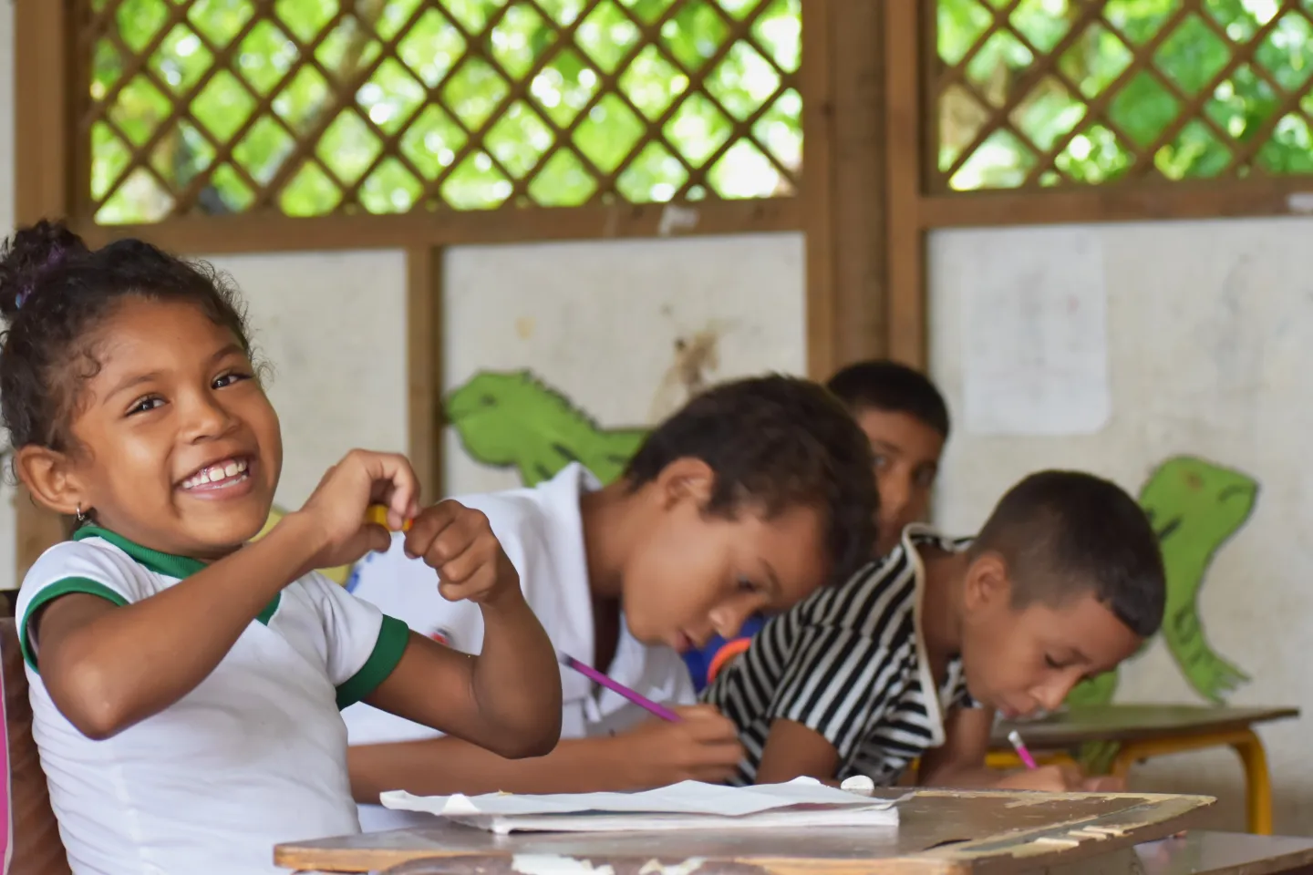 Children smiling in a classroom
