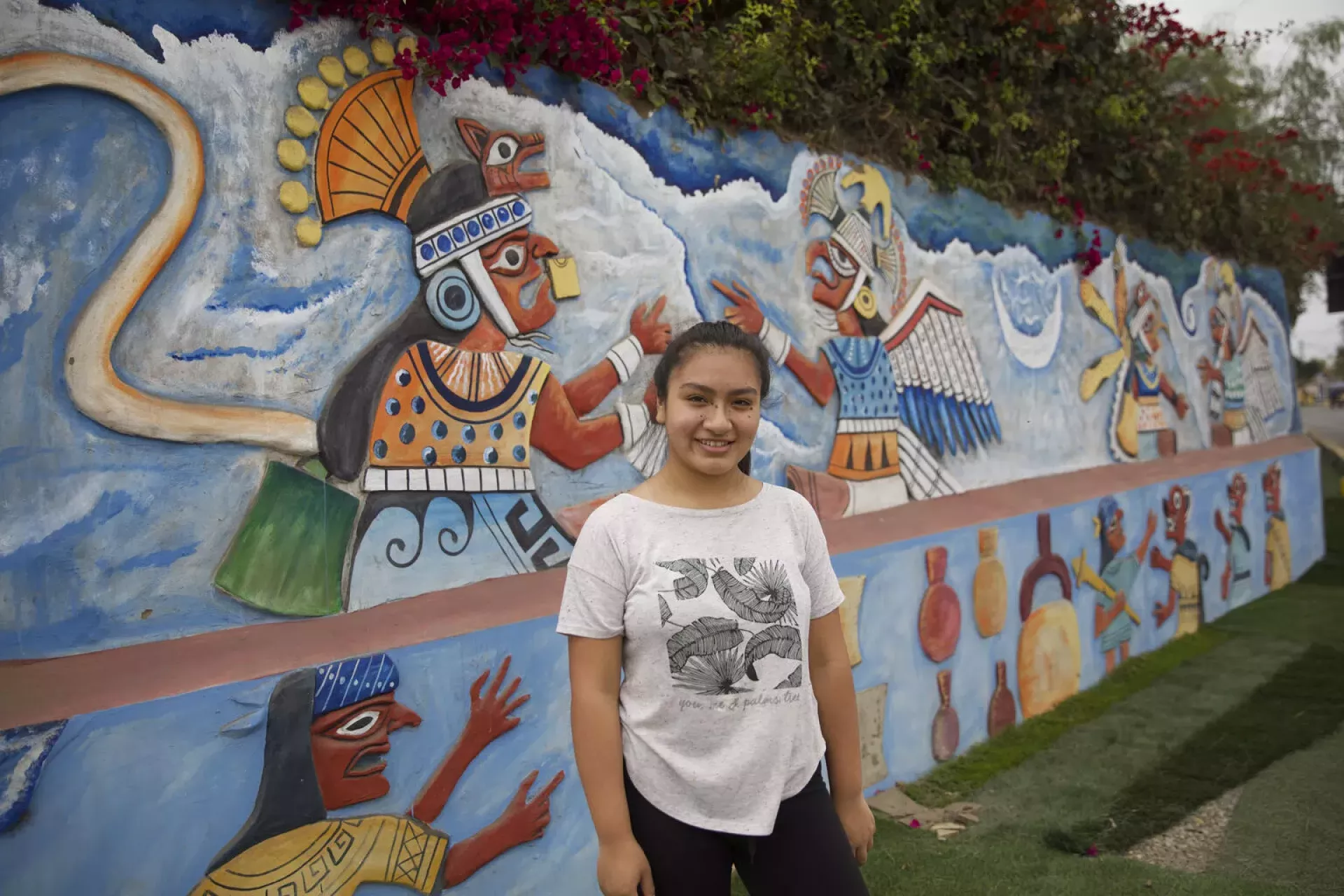 Fabiola S&aacute;nchez Montero, 16, a student from the Moche region in Peru poses in front of a mural