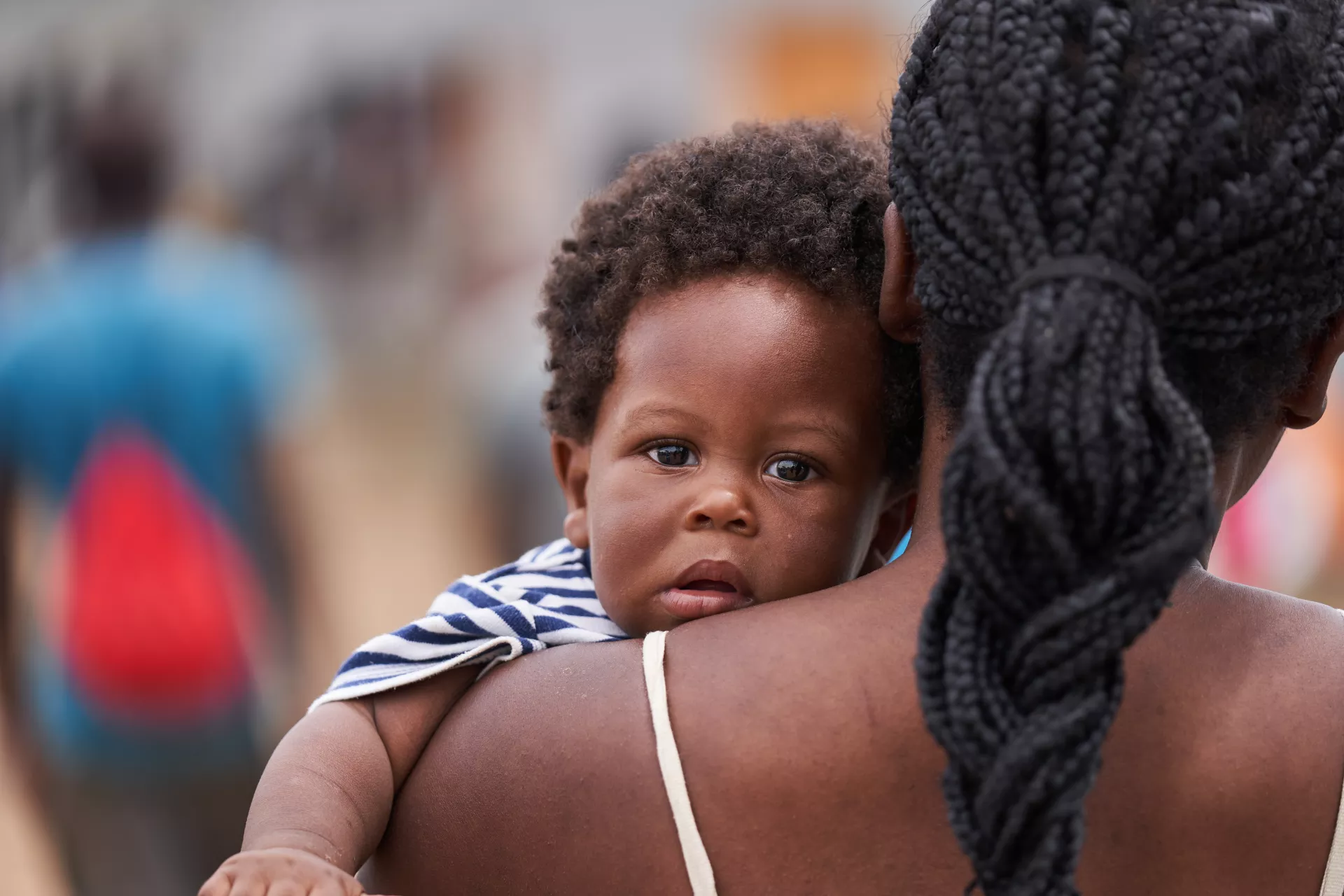 October 2021. MRS Lajas Blancas, Dari&eacute;n, Panam&aacute;. Mina Lareus (Haitian) holding her son, James Charles, in her arms while walking in MRS Lajas Blancas.