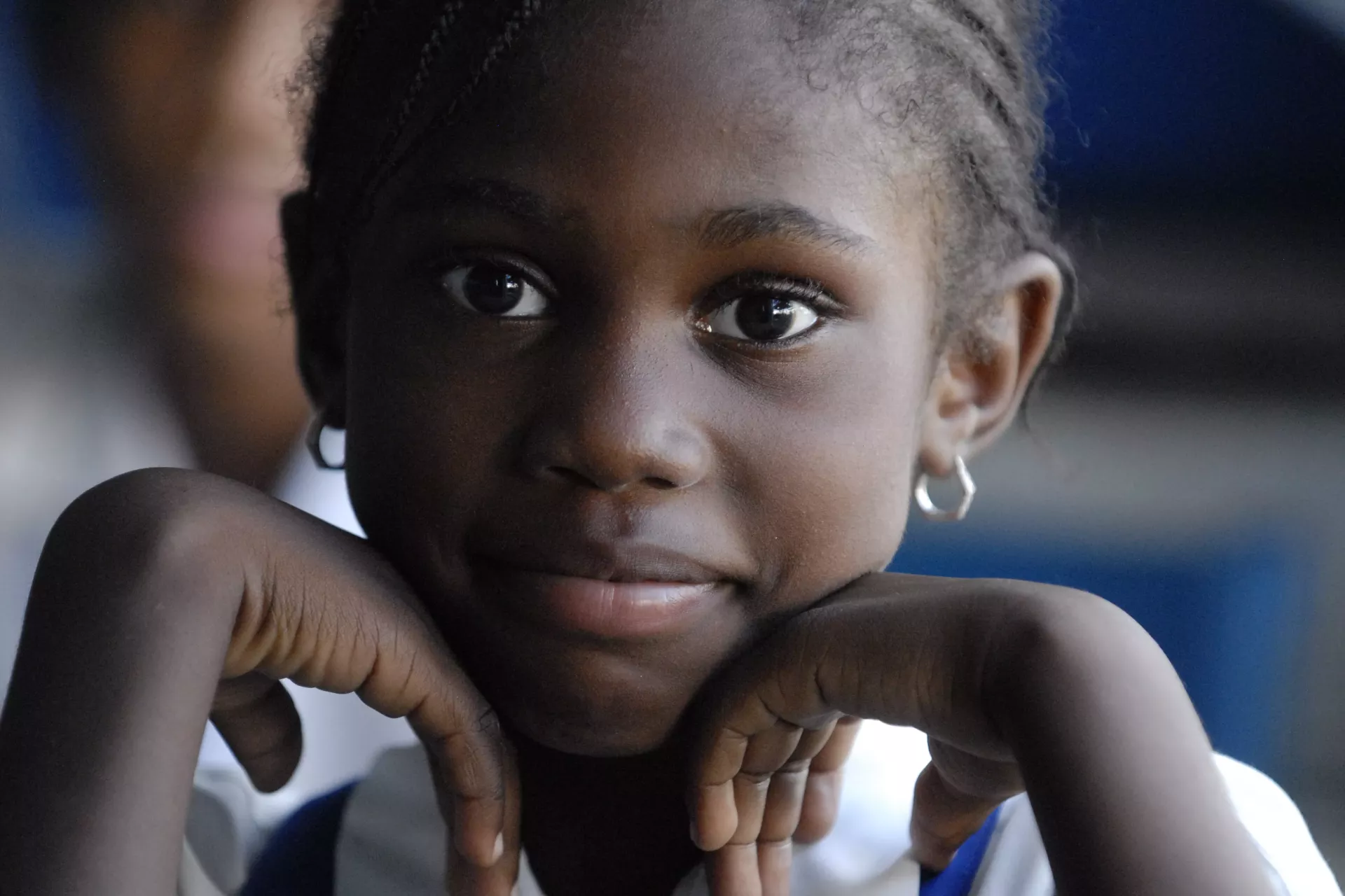 A schoolgirl listens to a discussion on non-violence during the visit of UNICEF