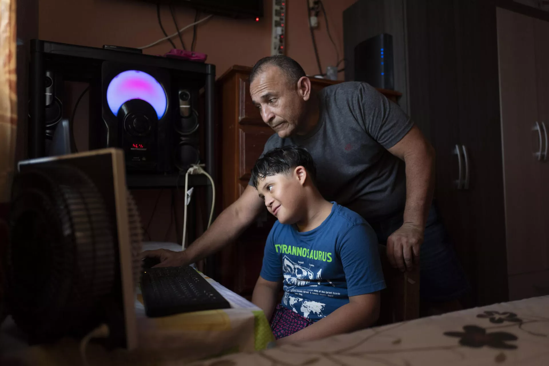 Fifth grade student Jorge studies and plays with his family after rerunning home from school in San Miguelito, Panam&aacute; City Metropolitan Area, Panama on 20 August 2019.