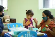 Belmopan, Belize. June 2021. Baby and her mother during routine check up with the pediatrician. Doctor Candy Azueta counsels the family on Care for child Development (CCD), a program implemented by UNICEF in Latin America and the Caribbean. Belmopan, Belize. June 2021.