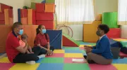 Santo Domingo, Dominican Republic, June 2021. A family visits the pediatrician for a routine check-up. Dr. Lourdes Perez counsels the family on Care for Child Development (CCD), a programme implemented by UNICEF in Latin America and the Caribbean.