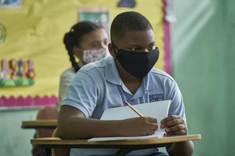 Boy and girl back to school in pandemic