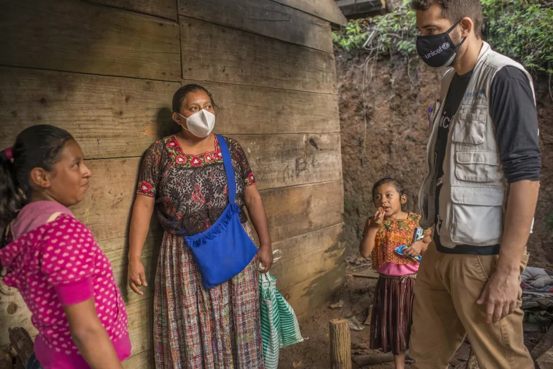 Manuel Moreno, Regional Communications Specialist UNICEF LACRO, talks with Florinda Yatchub and her family living a temporary shelter in Sacsi Chita&ntilde;a, in Alta Verapaz, Guatemala. On Dec. 2, 2020.