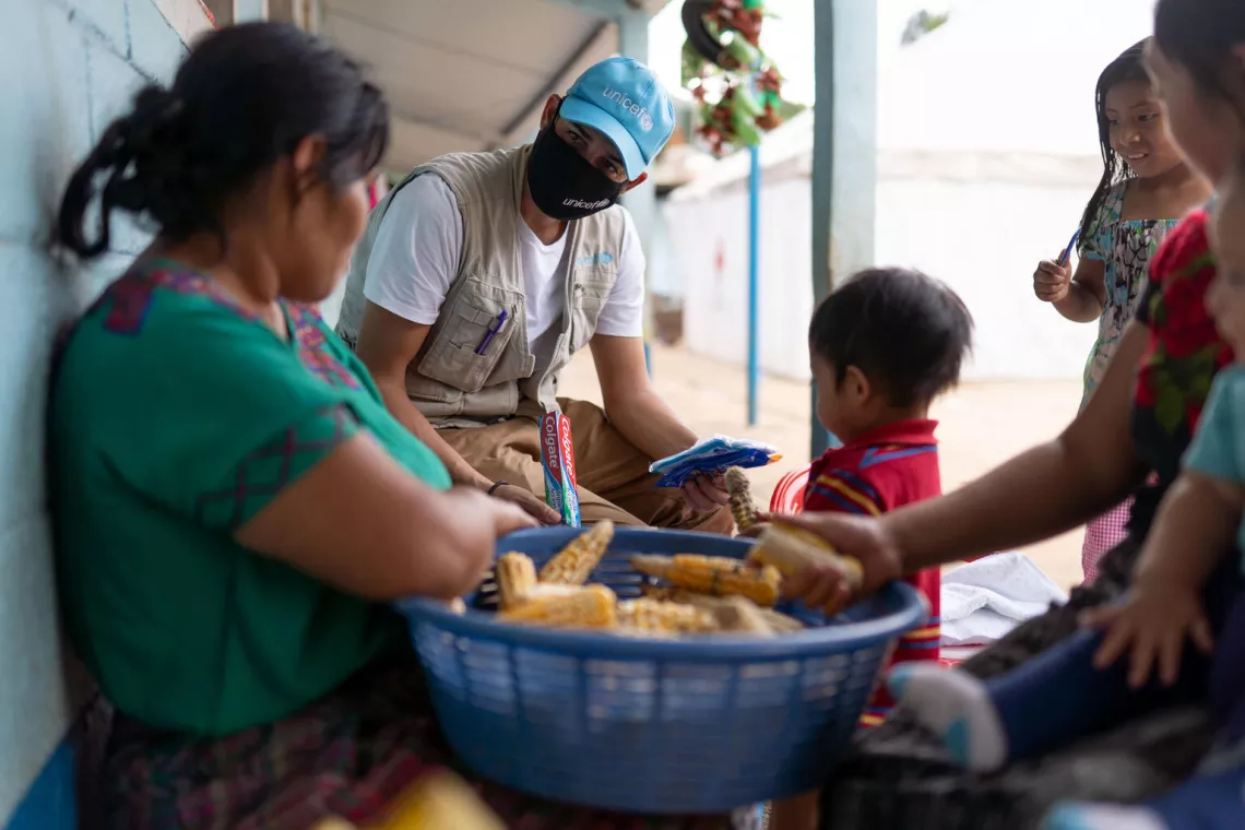 Manuel Moreno, a UNICEF communication specialist, delivers a hygiene kit to a family.