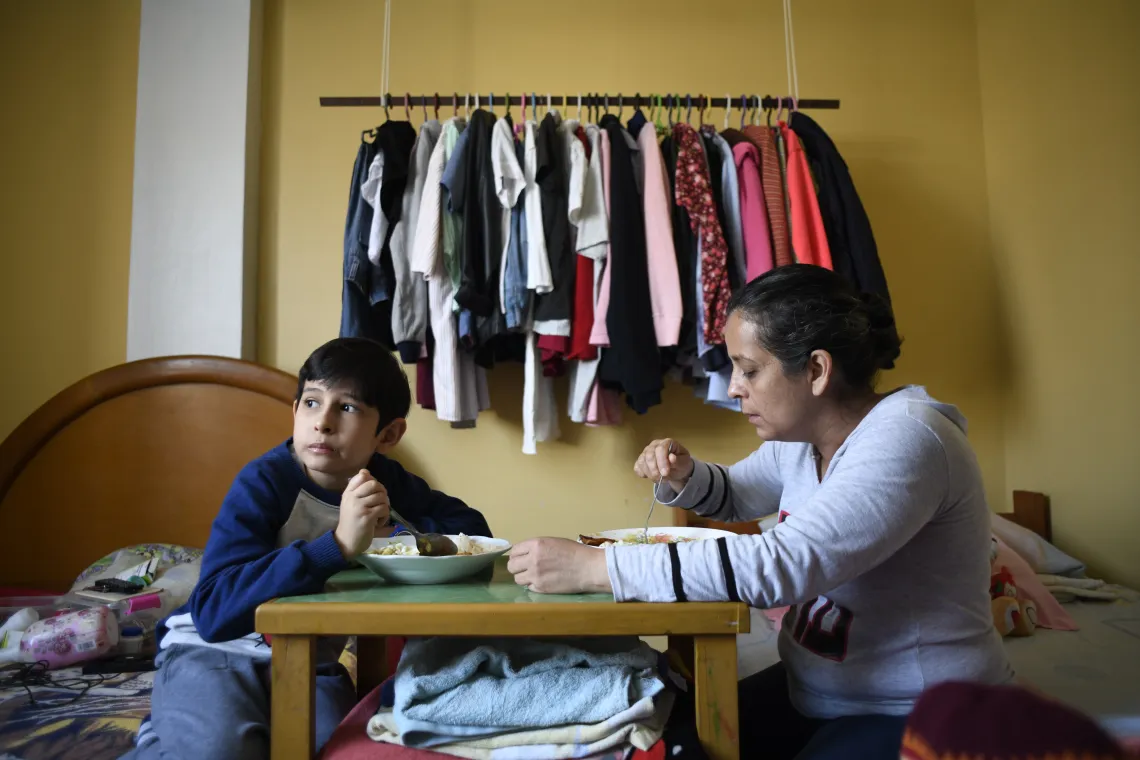 In&eacute;s Rosales and her son Samuel (10) having lunch at the small dwelling they occupy with their family in San Martin de Porres district in Lima, Per&uacute;, on september 23th, 2020.