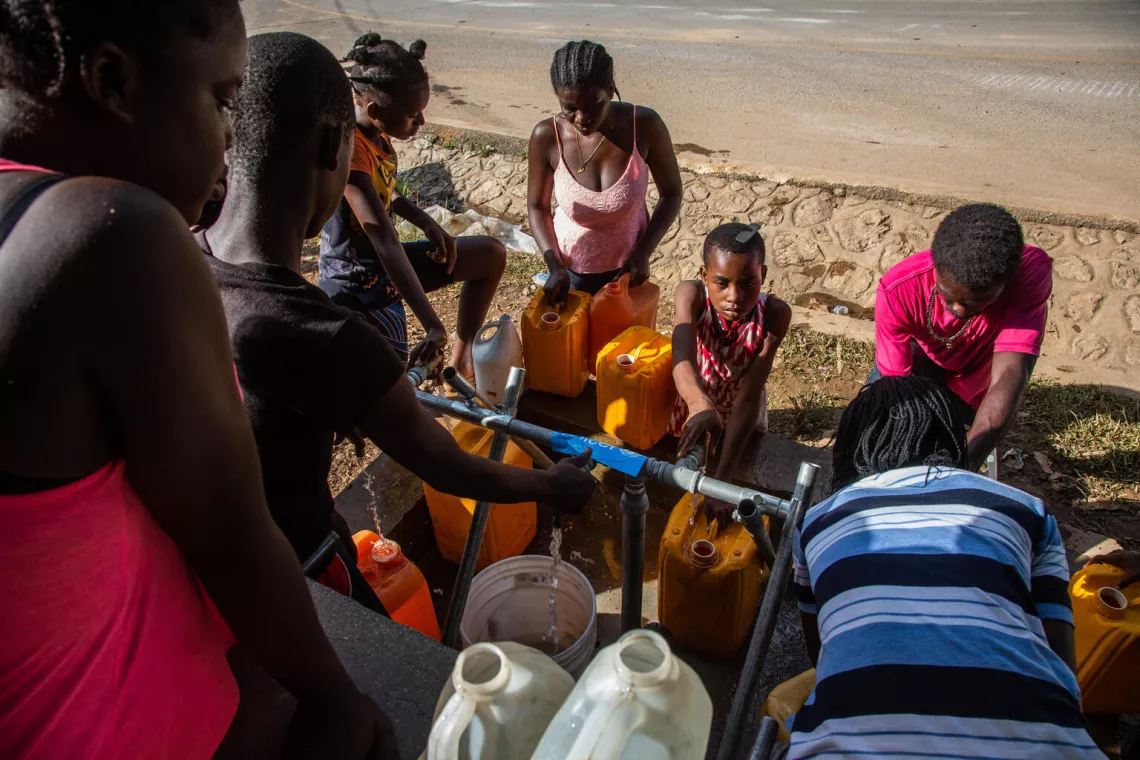  In Marceline, near Camp Perrin district, children and their families have access to clean and safe water at one of the four water stations supported by UNICEF in Les Cayes, Haiti.