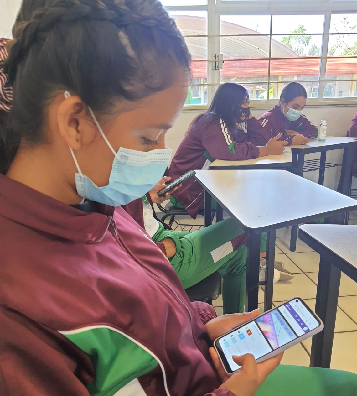 A student looks at a tablet in a classroom 