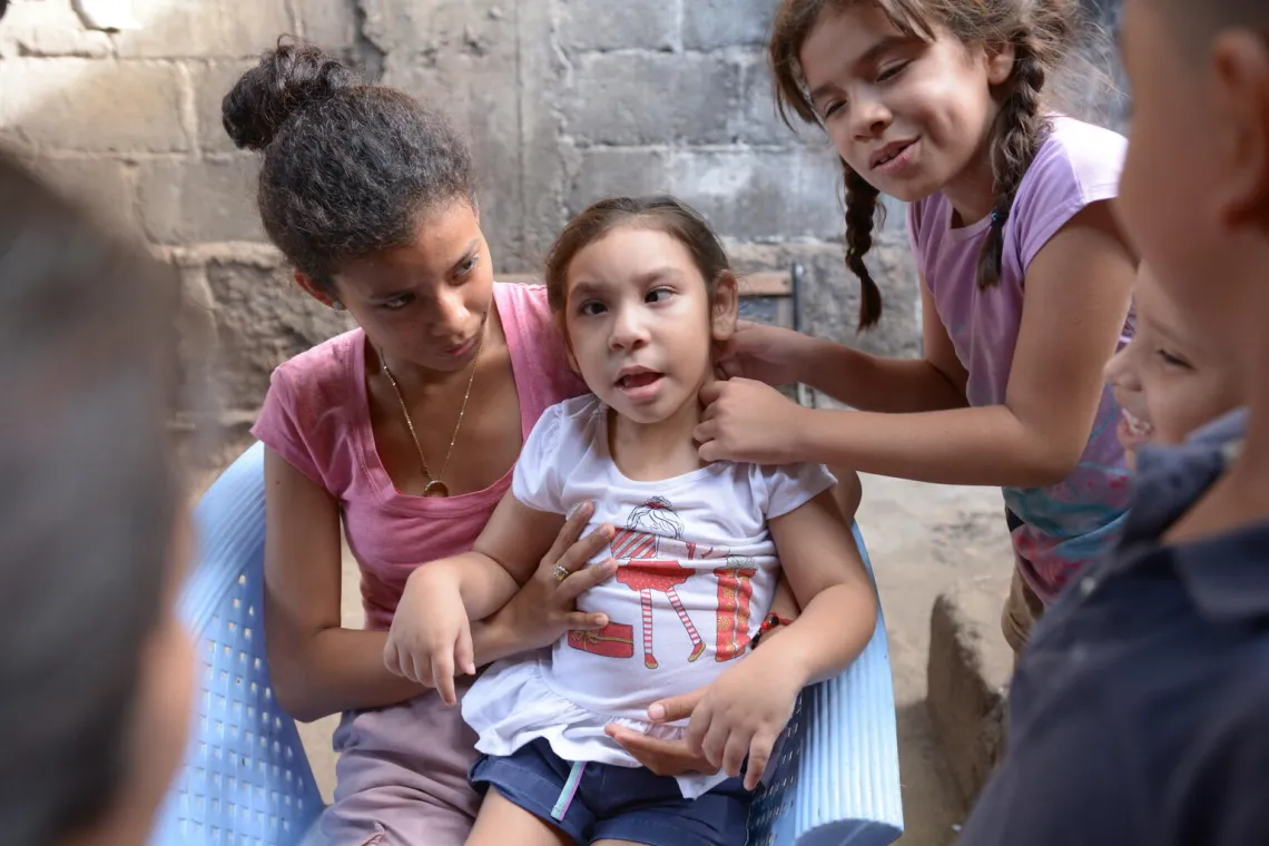 Managua, Nicaragua, June 2021. Children play during a routine check-up. Doctor Nerys Galeano counsels the family on Care for Child Development (CCD), a program implemented by UNICEF in Latin America and the Caribbean.