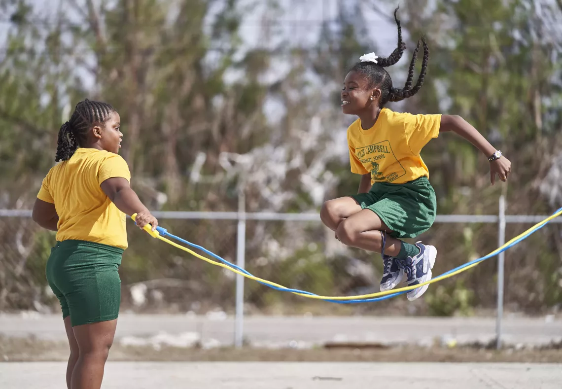girls jump rope during a break