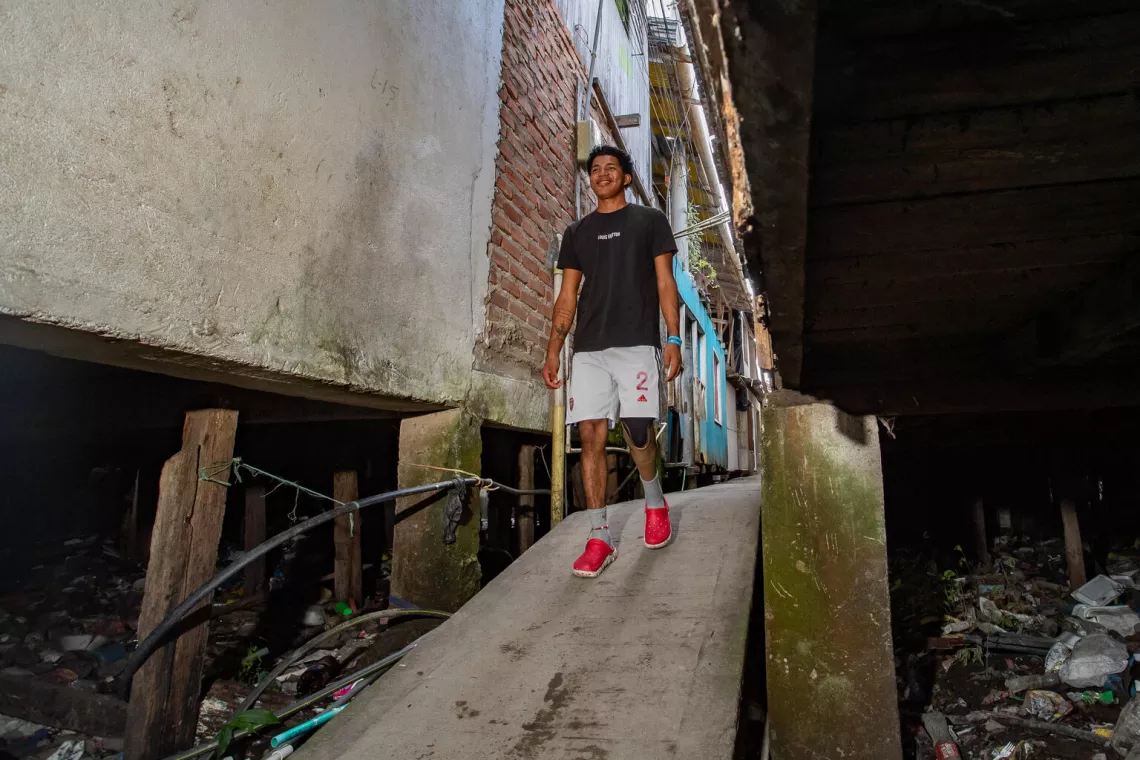 Jose is walking down a ramp