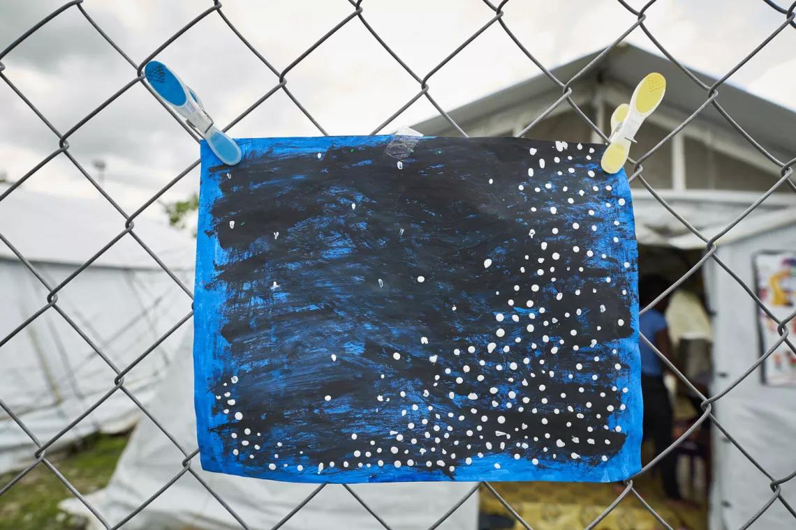 A drawing made by a migrant child representing the night and stars. 