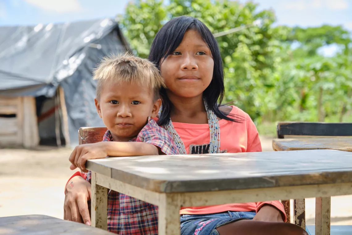 Anti Franchi, 2, and Cristin Gomez, 9, from Enape indigenous community, looks at the camera in Guasdualito, Apure state, on October 01, 2021. 