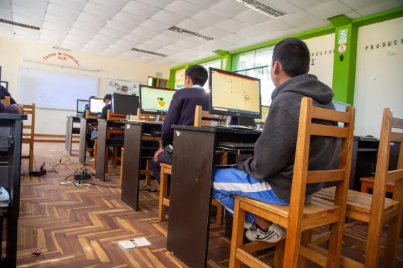 A group of students using computers in a classroom 