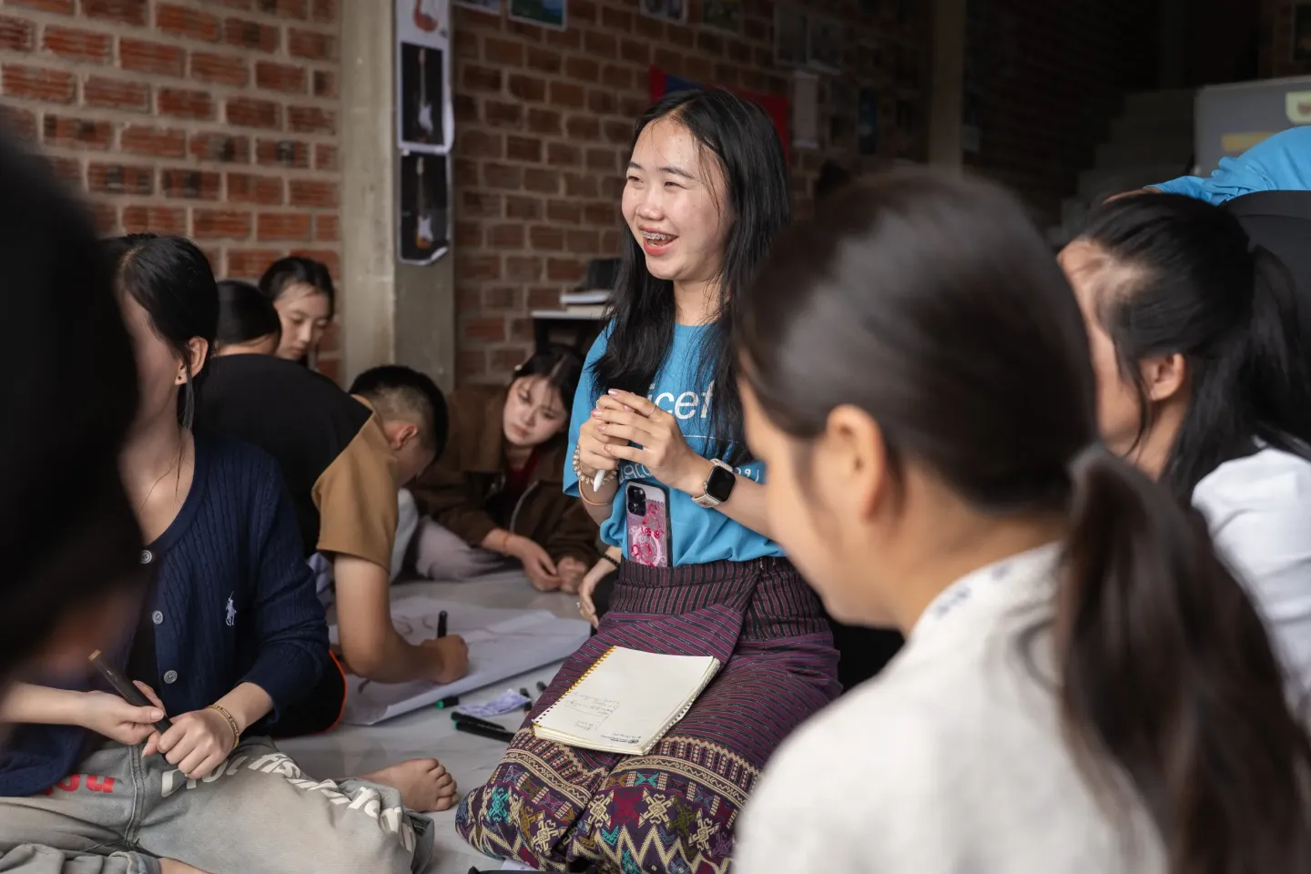 Chan, a youth advocate on child marriage, discussing with participants. 