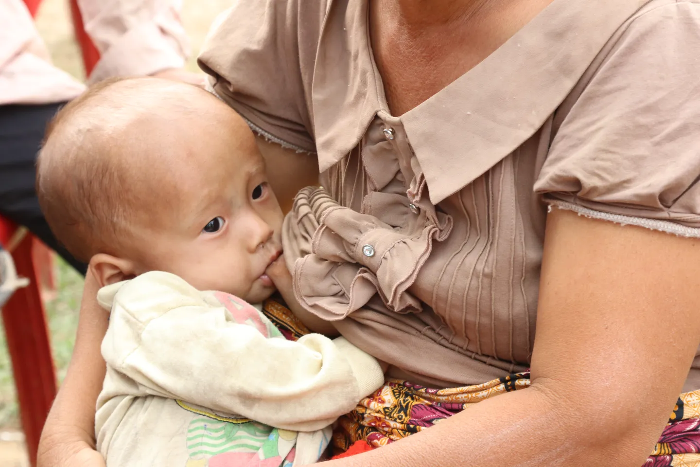 A mother breastfeeding her child.