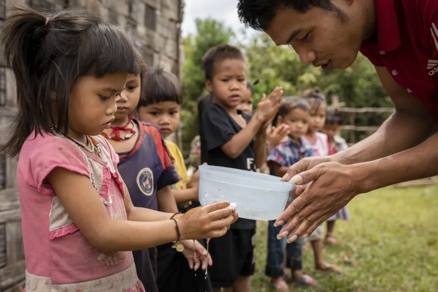 Handwashing with soap is one of the WASH in School activities at the Community-Based School Readiness (CBSR) Program Centre. At TaHeunmai Village, Taoy District, Saravan Province, Lao PDR.