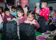 A girl after receiving school materials.