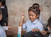 A girl after receiving school materials.