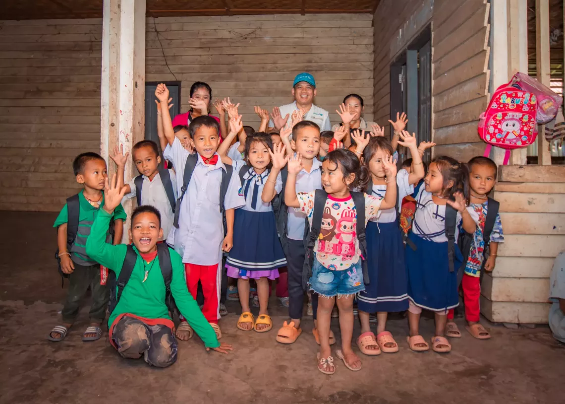 A group of Childrens after receiving school materials