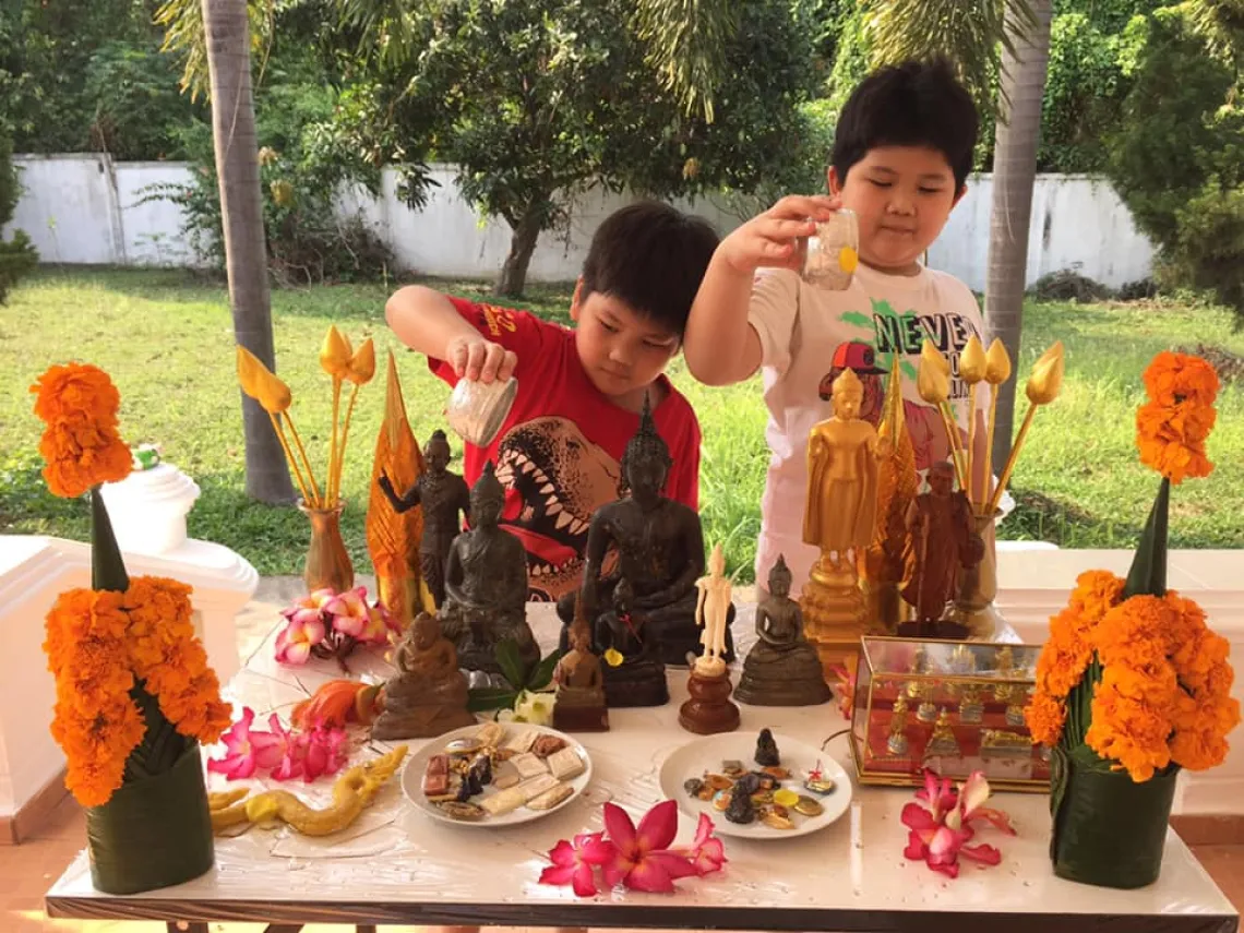 Children offering water